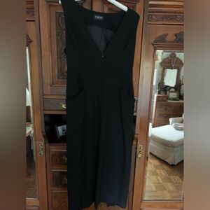Black, Finity sleeveless dress. Size 10 with pockets. Great style.